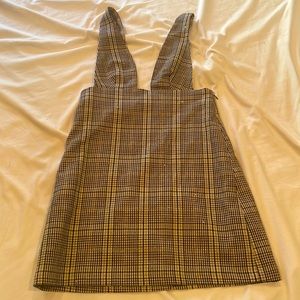 Checked print jumper/overalls. Nude, brown, black jumper dress. Size small